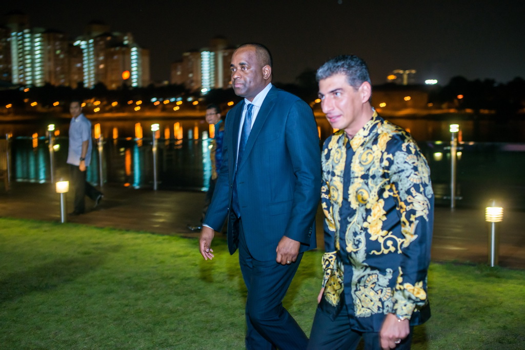 Dominican Prime Minister Roosevelt Skerrit (left) and Ali Reza Monfared, the man who bought a diplomatic passport [Al Jazeera]